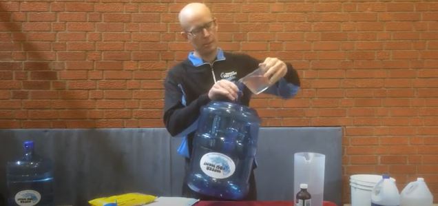 How do you properly clean a 10-gallon food storage container? 