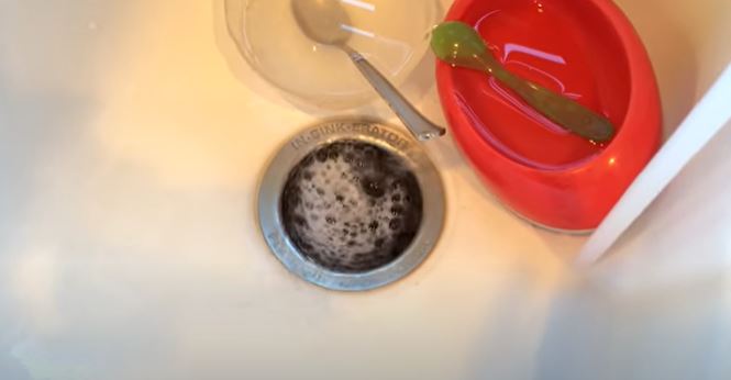 How to prevent black water backing up in the kitchen sink 