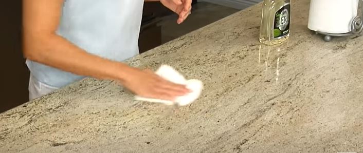 How do you properly seal and protect granite in an outdoor kitchen?
